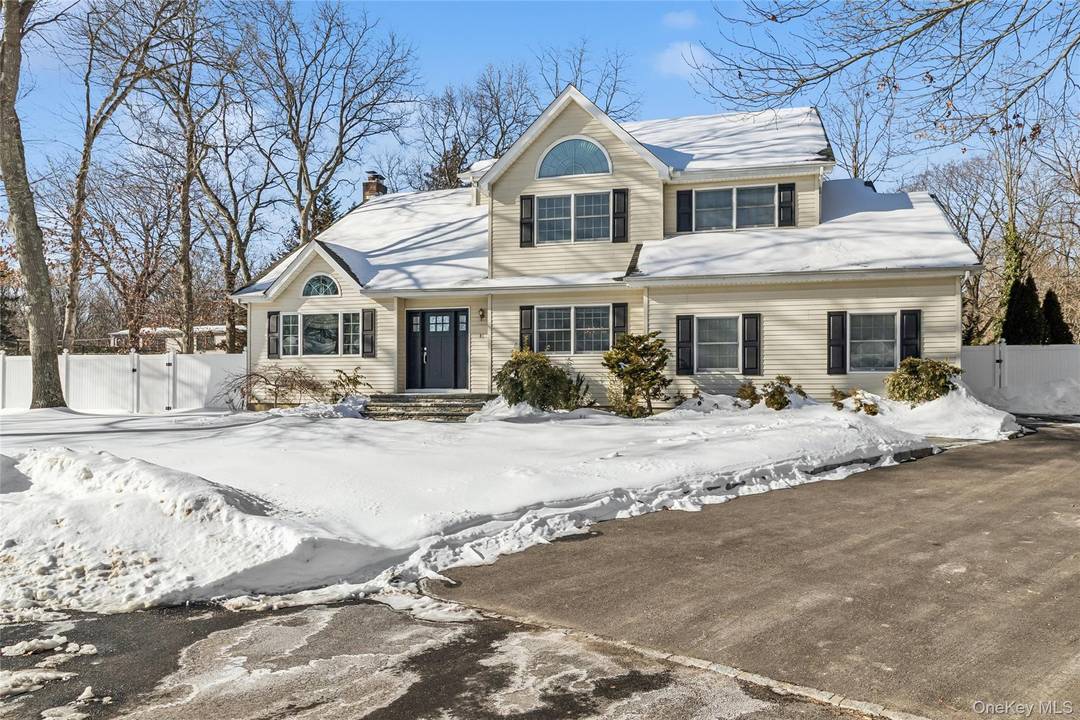 Welcome to 41 Locust Drive, a magnificent Colonial style home nestled in the heart of Nesconset.