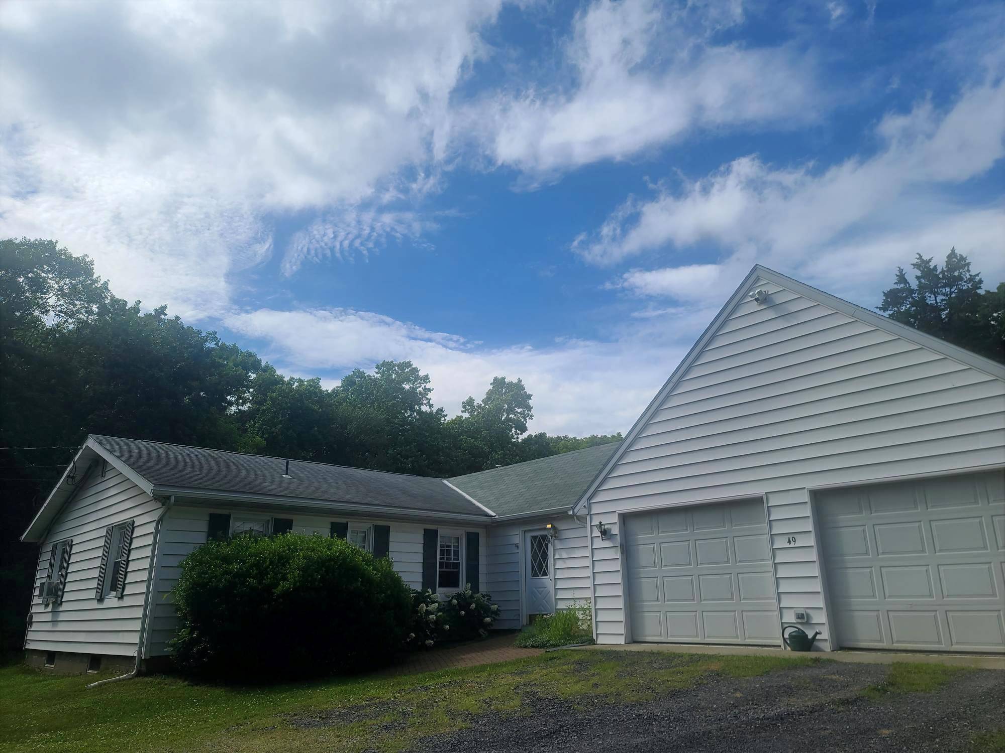 LIVING IS EASY in this low maintenance luxury ranch on almost 8 acres of privacy and tranquility.