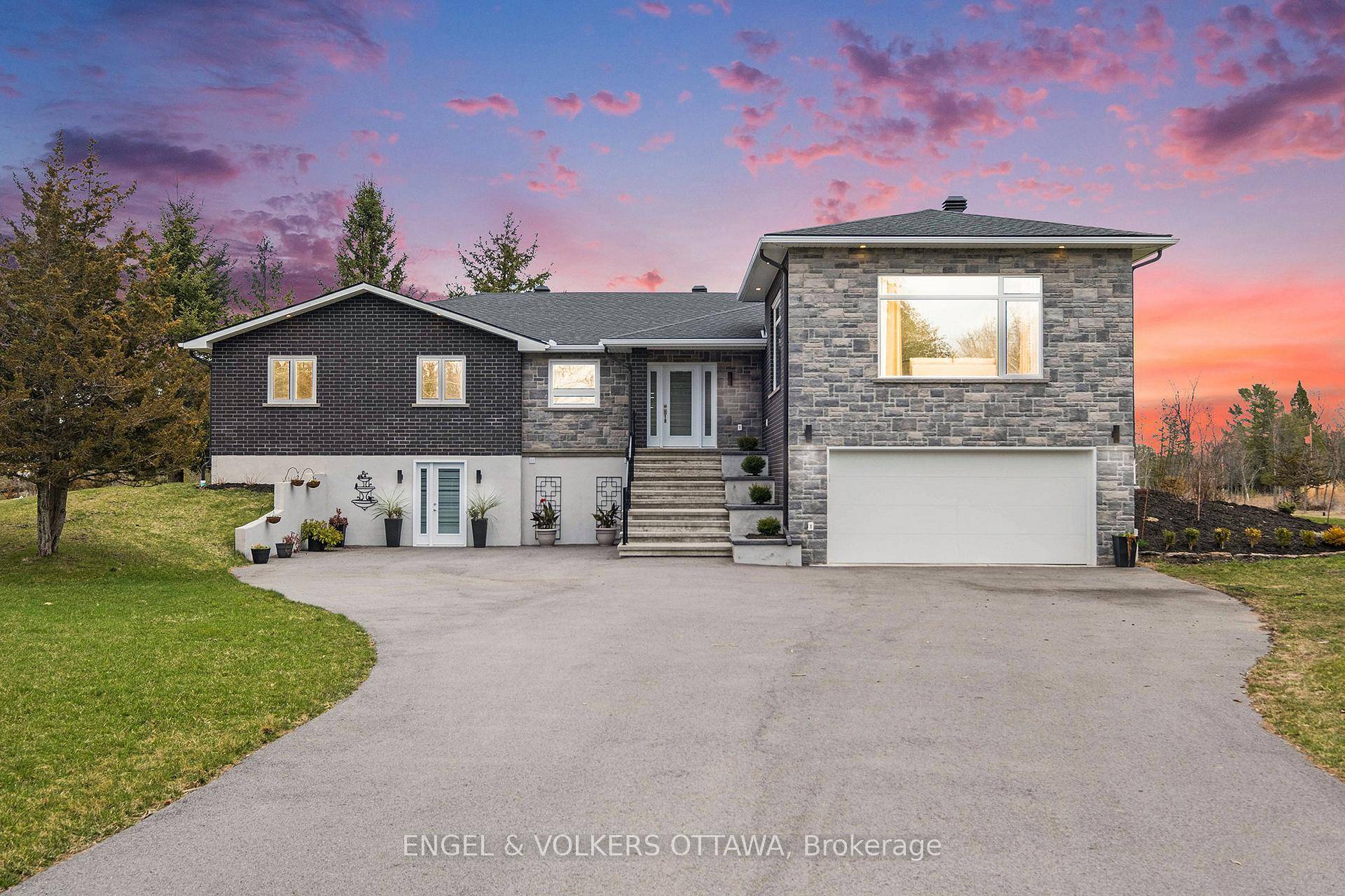 Stunning 2 story home on 3 Acres 2 Kitchens, 60 ft Deck, High End Finishes.