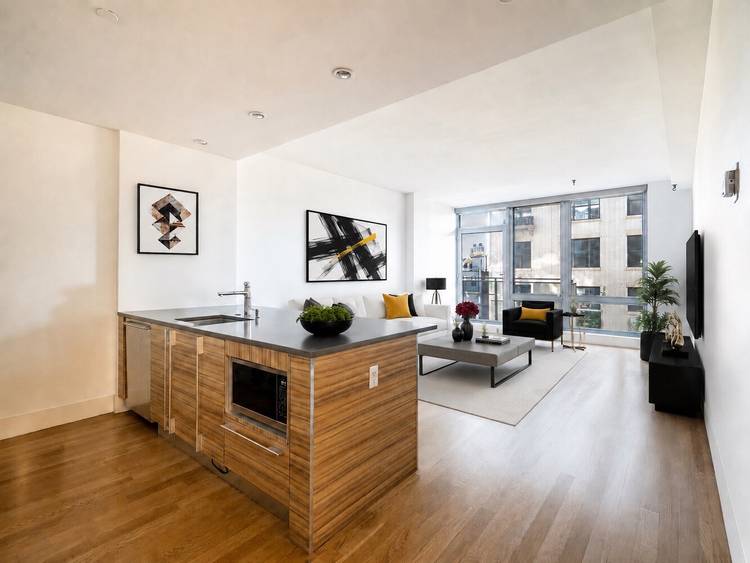 This beautifully proportioned two bedroom, two bath residence captures abundant southern light through floor to ceiling windows and glass doors that open to private balconies off both the living room ...