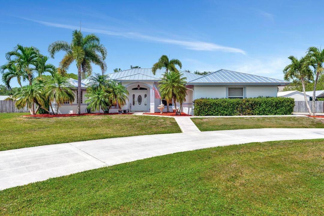 Welcome to your dream home in desirable Jupiter Farms !