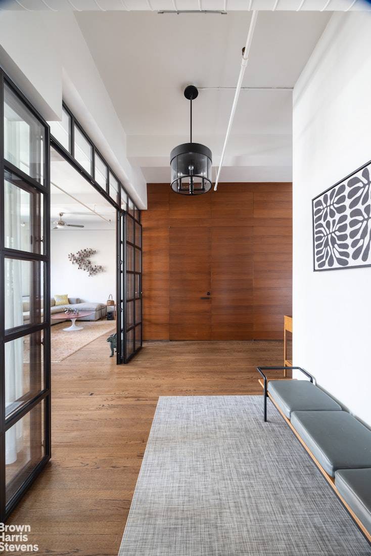 Gorgeously renovated full floor condo loft in prime Chelsea with spectacular light and open views.