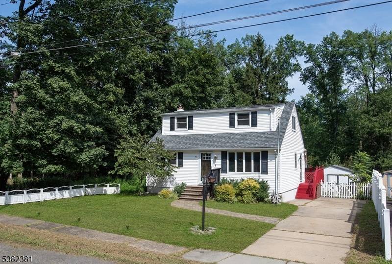 This quiet and private home sits at the end of a peaceful street, surrounded by trees.