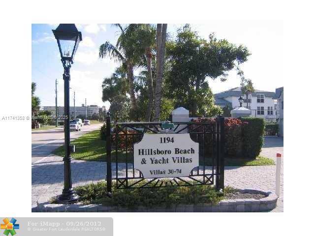 Beautiful tri level townhome on prestigious Hillsboro Mile !