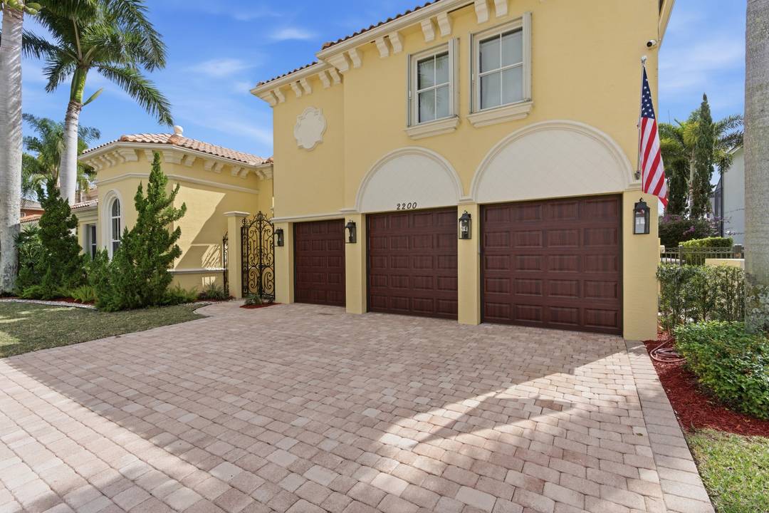 Exquisitely appointed Mediterranean estate in the prestigious Widener Village enclave of guard gated Olympia.