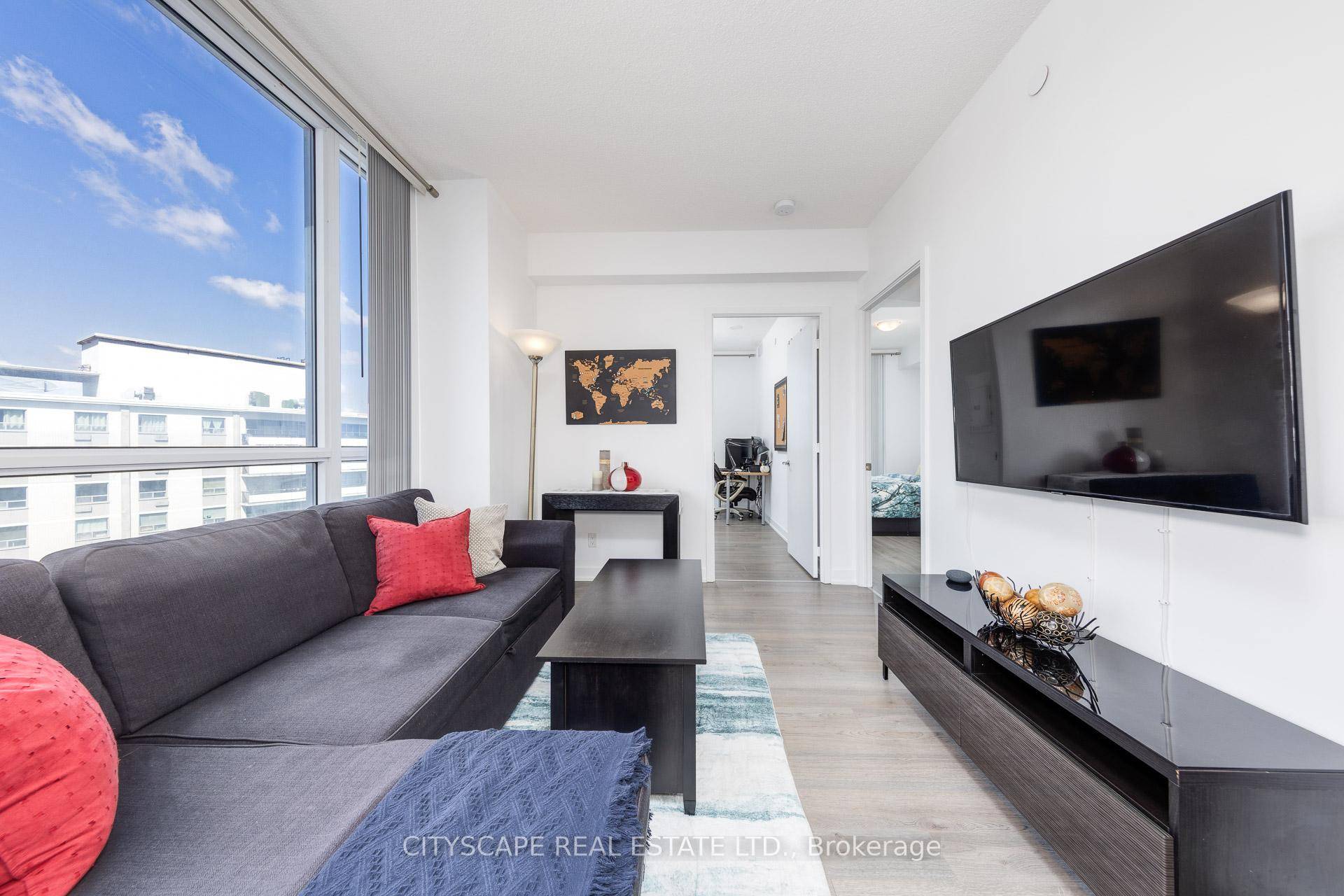 Bright and spacious corner unit with unobstructed view of lush greenery.