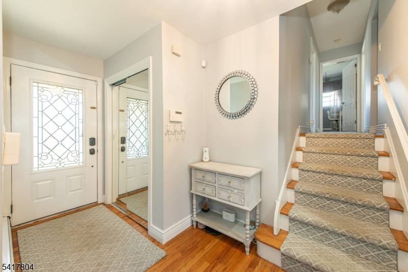 Step into refined comfort in this beautifully expanded, custom split level home, quietly set on a tranquil street.