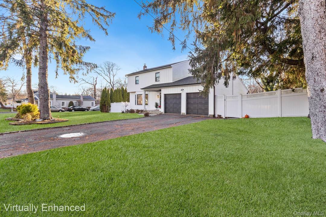 Welcome to this beautifully maintained Colonial set on a quiet, country tree lined street in the highly regarded Miller Place School District.