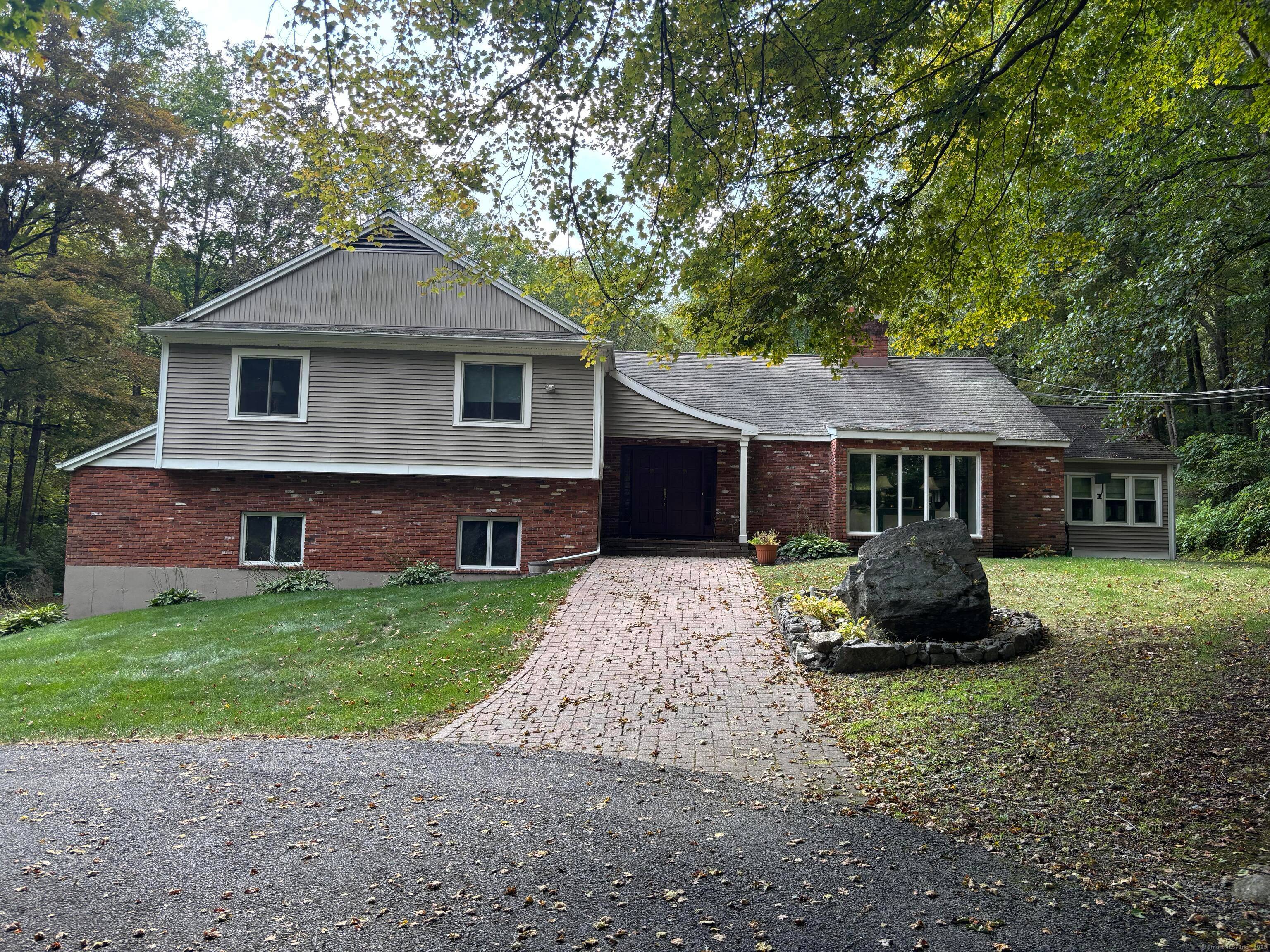 Discover your tranquil retreat at 80 Pine Hollow Drive !