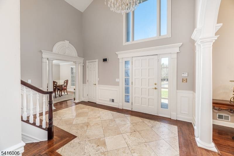 Nestled on 5 sprawling, private acres in one of Mendham borough's most sought after neighborhoods is this opulent custom colonial blending country living with modern finishes.