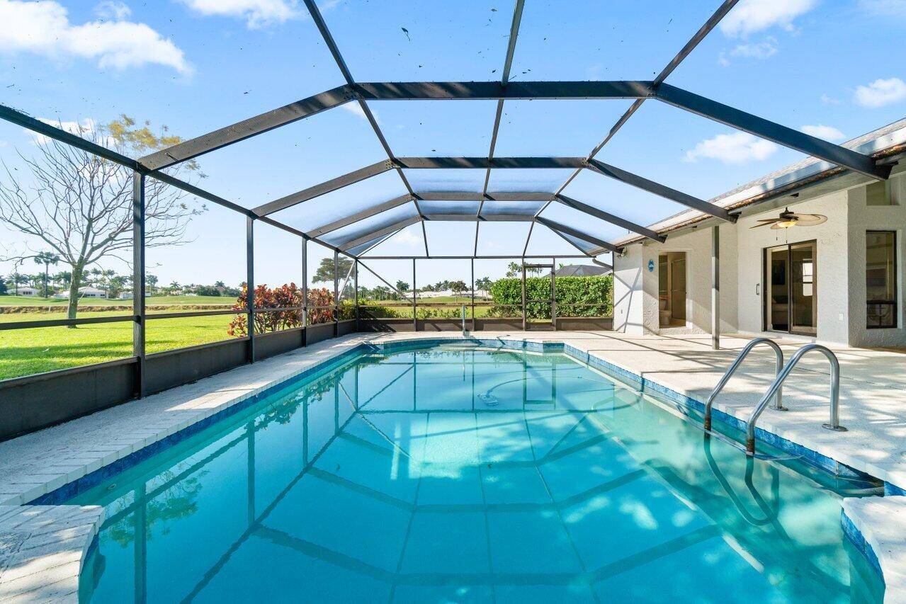 Estate Home w views of the Canal the Polo Club Golf Course Oversize Lot in a private Cul De Sac Heated Screened Salt Pool 30X15 adds to great entertaining Pentaire ...