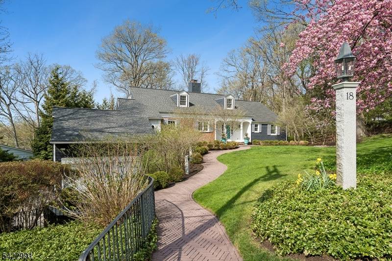 Exceptional 6BR, 4. 1BA custom Colonial set on a lush 0.