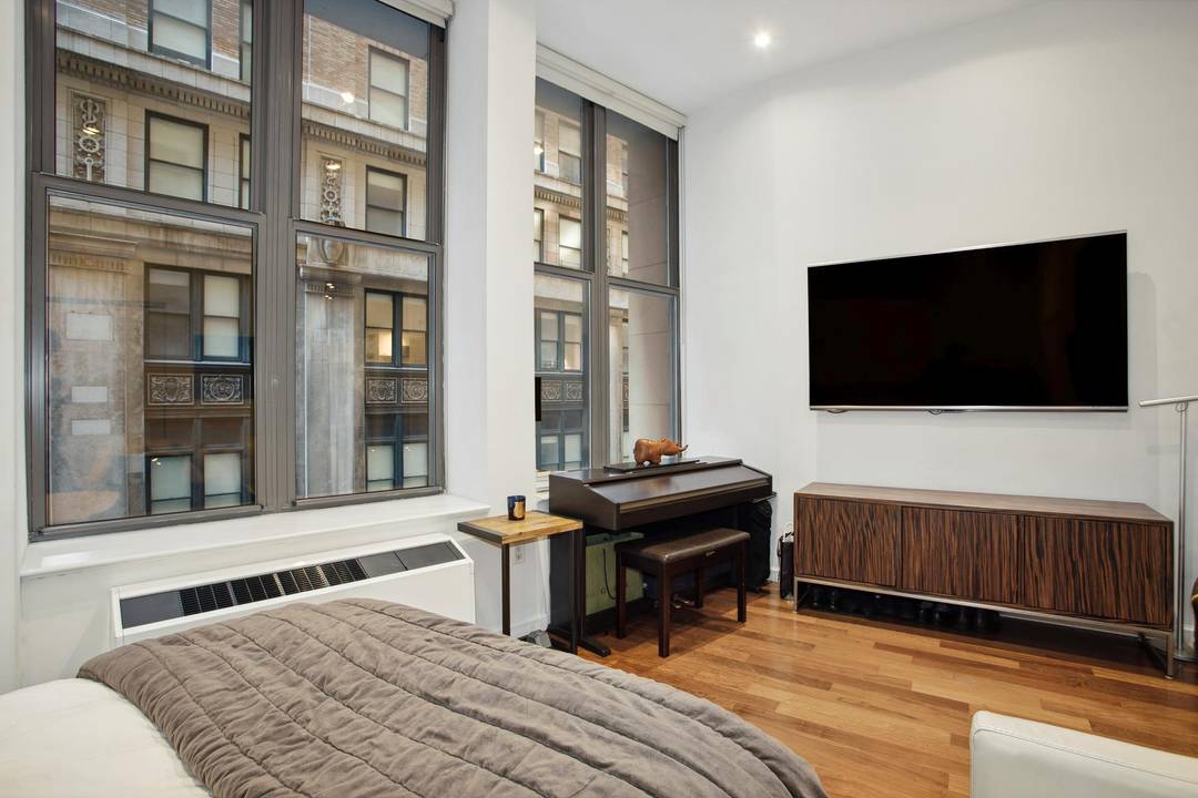 The Cocoa Exchange is home to unit 207, a charming studio featuring 11 foot ceilings.