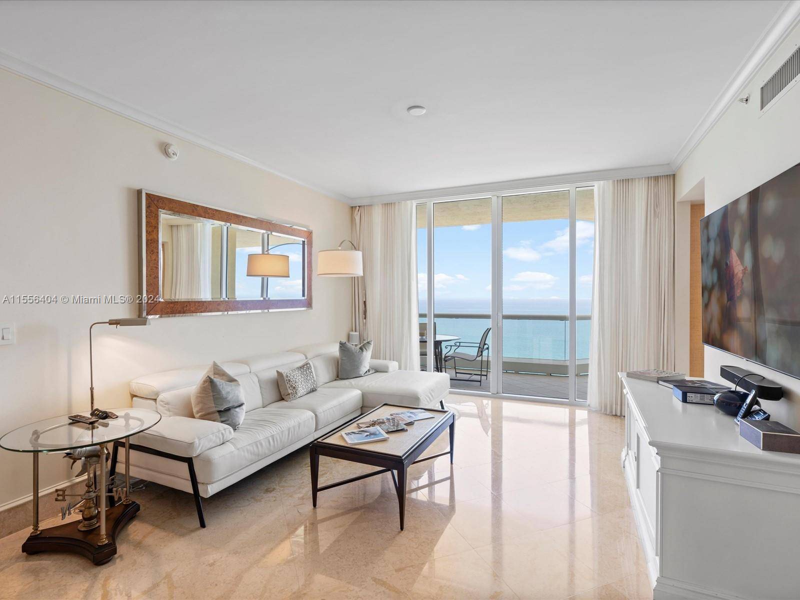 Experience luxury living at its finest in this stunning 3 bedroom, 3 bathroom unit located at the prestigious Acqualina Resort and Residences.