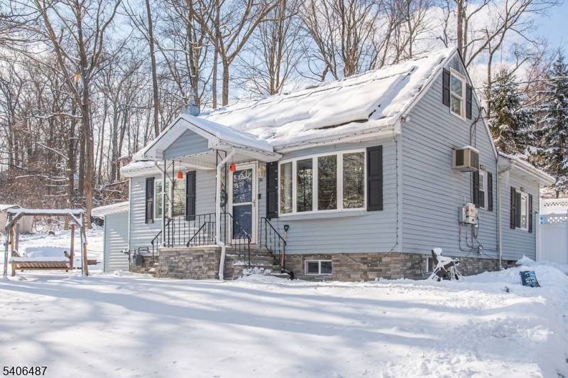 Desirable expanded Cape Cod located in lower West Milford.