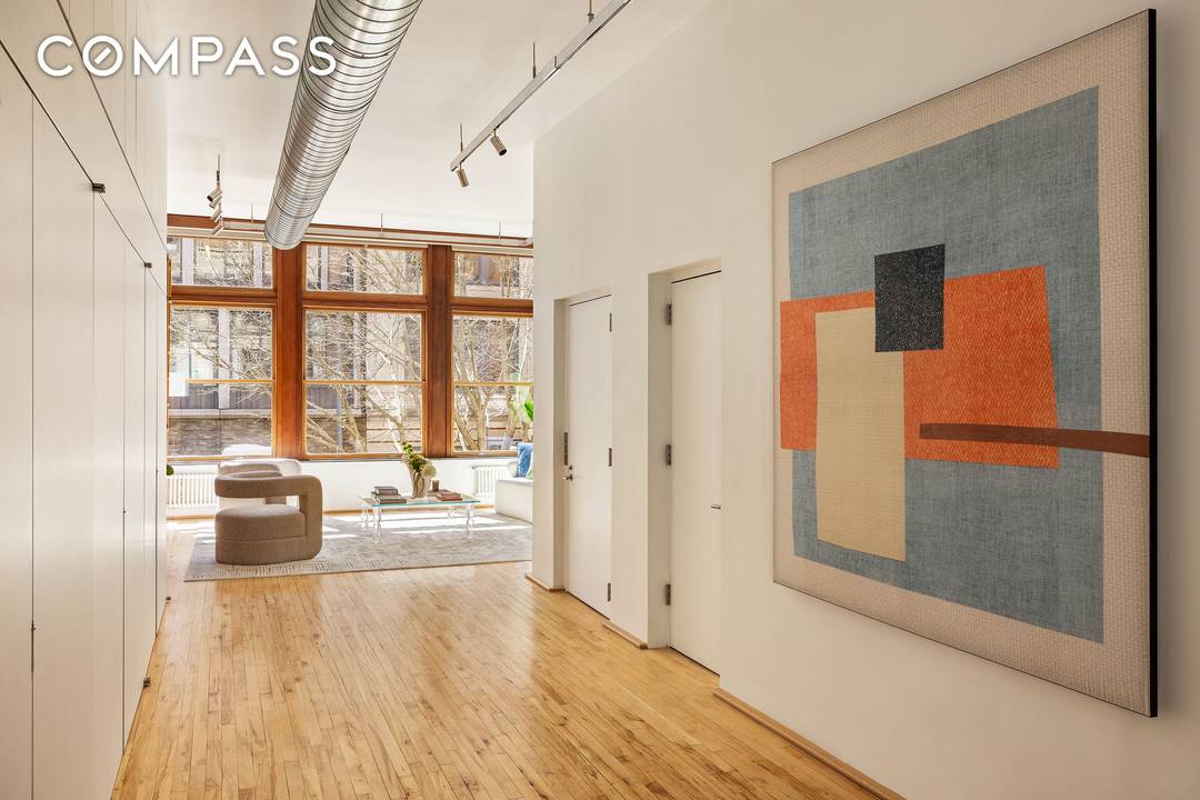 Step out of your key locked elevator directly into a full floor NoHo loft where classic Downtown Manhattan architecture meets a thoughtful 2011 modernist gallery style renovation by ICON Architects.