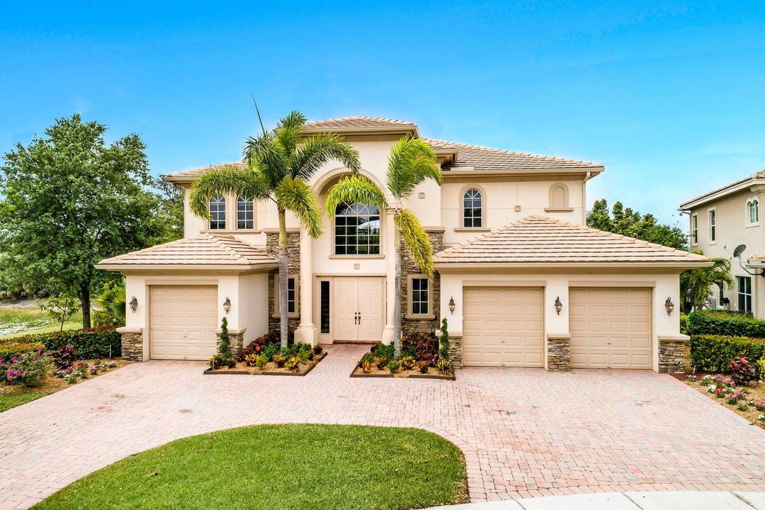 Welcome to this magnificent Ternbridge model by Toll Brothers, ideally located on a private cul de sac lakefront lot in the prestigious, manned gated community of Wellington View only 178 ...
