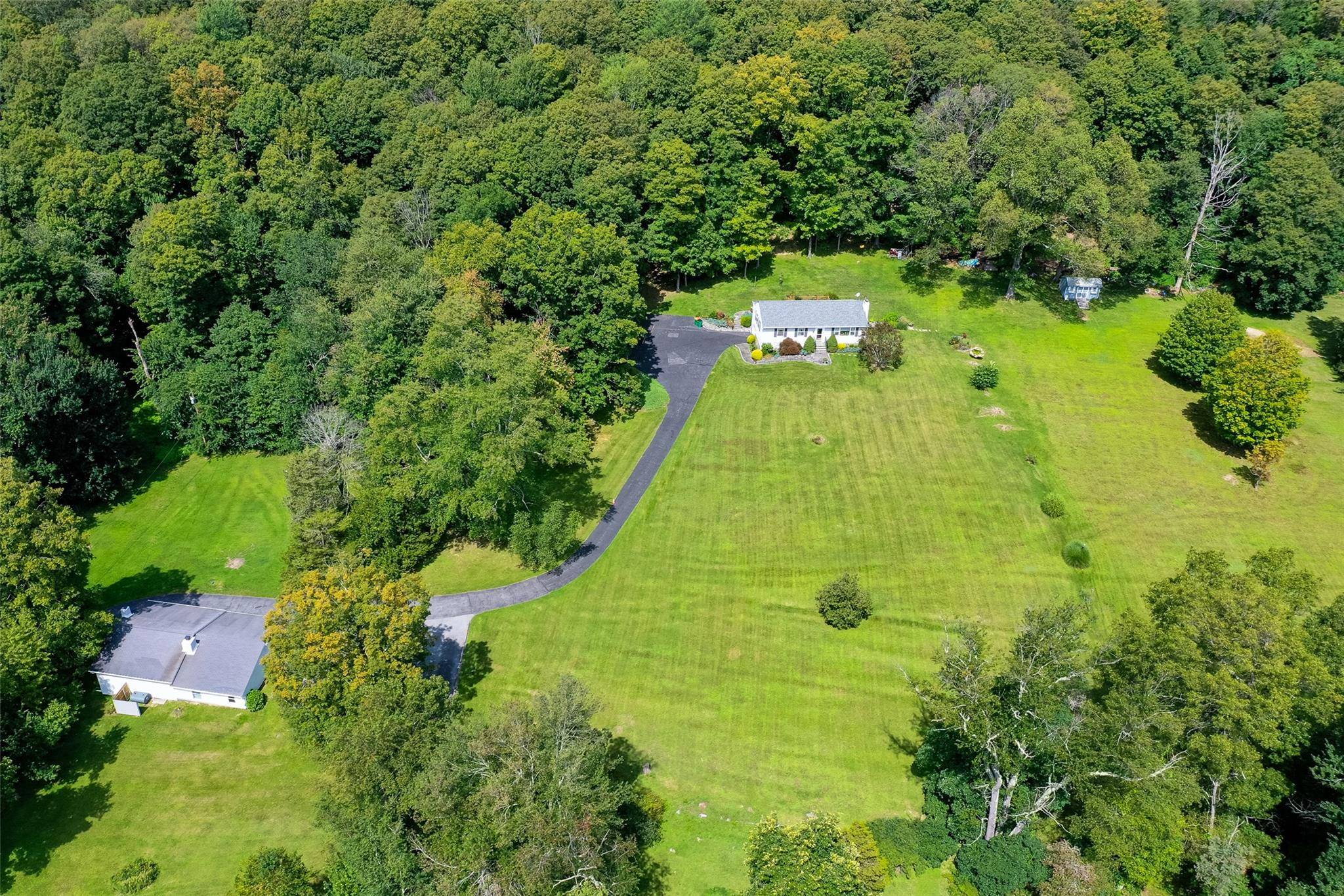 Very rare opportunity to own TWO IMPECCABLY MAINTAINED HOMES on a stunning 11.