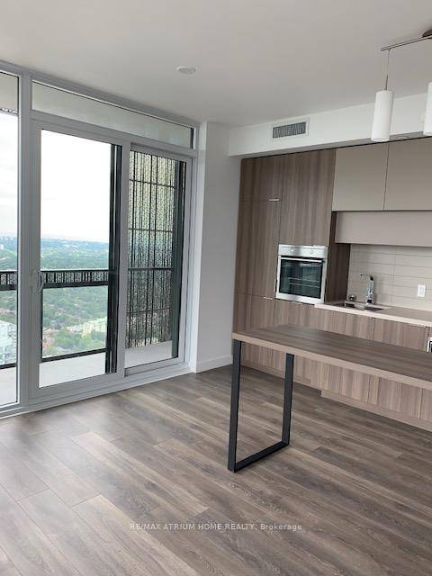Beautiful two bedrooms corner unit with breathtaking North East view, wrapped around balcony, 9 foot ceiling, upgraded stainless steel appliances.