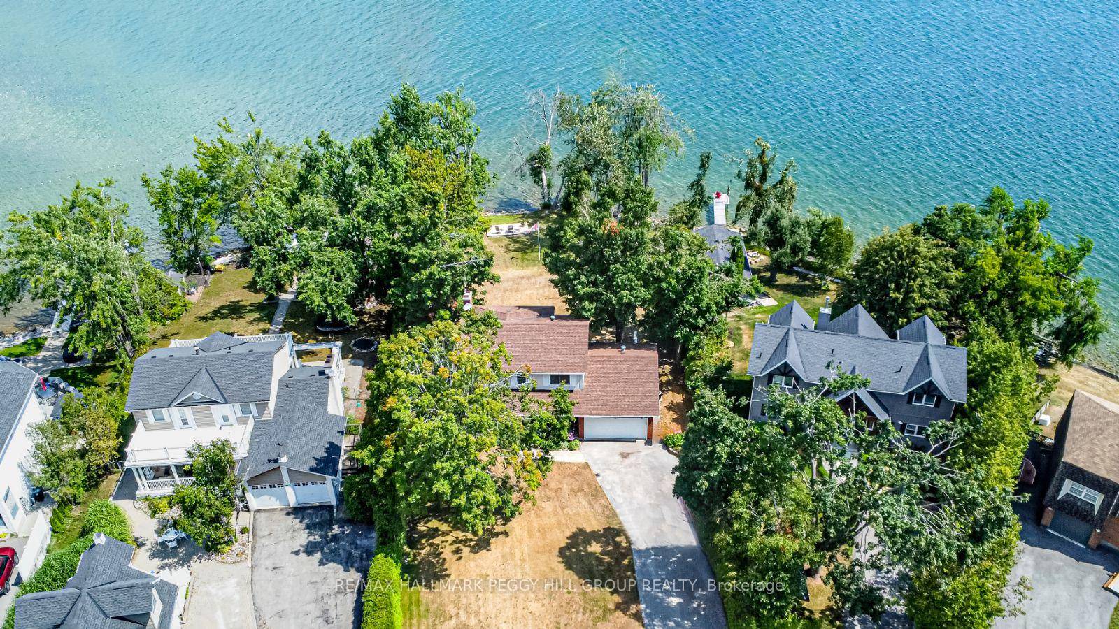 104 FEET OF IDYLLIC LAKE SIMCOE SHORELINE, WHERE SUNRISE SERENITY MEETS TIMELESS ELEGANCE !