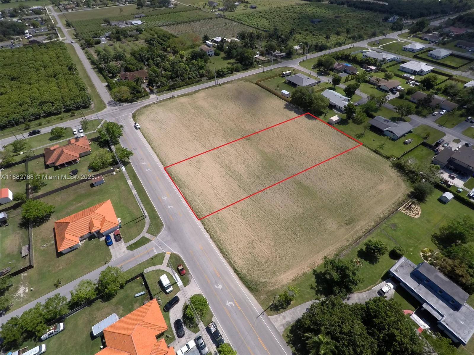 Just shy of a full a acre and on a paved road just outside of town !