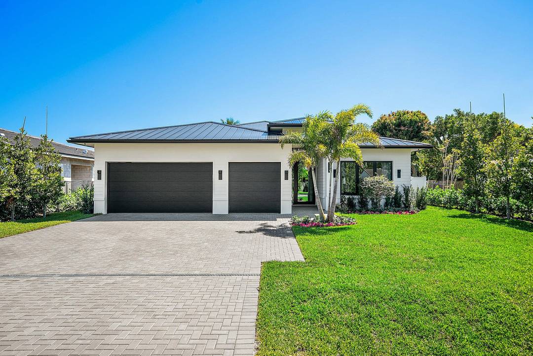 Welcome to a fully turnkey, designer furnished residence in the highly sought after Lake Ida neighborhood of Delray Beach.
