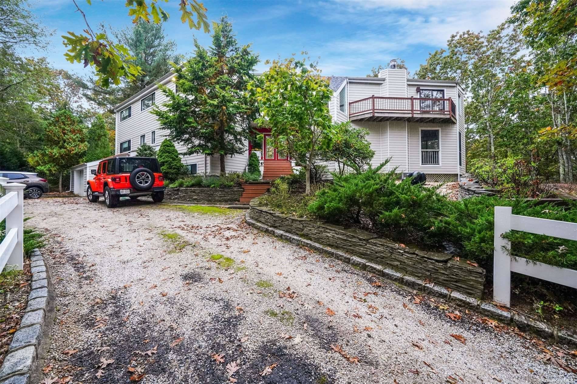 This beautiful contempory home is set back on a secluded 1.