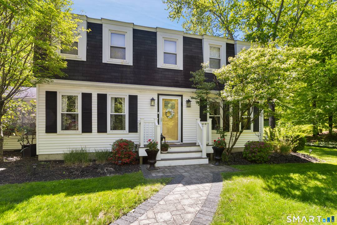 Welcome to this stunning beautifully maintained 4 bedroom colonial home in one of Brookfield's most prestigious neighborhoods that blends classic charm with today's modern comforts.