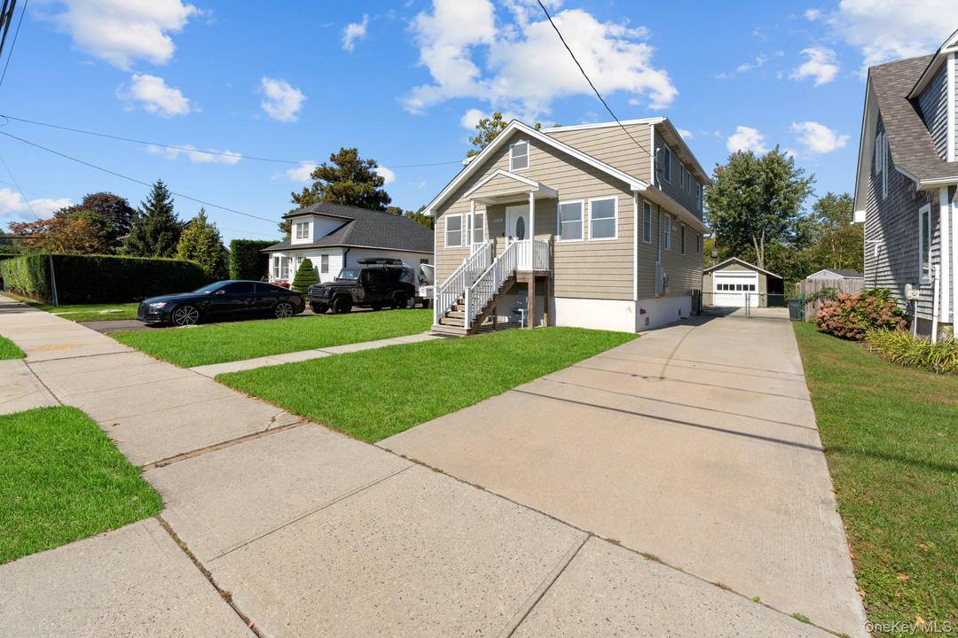 Welcome to this beautifully designed 5 bedroom, 2 bathroom home located south of Montauk in the vibrant heart of Patchogue Village.