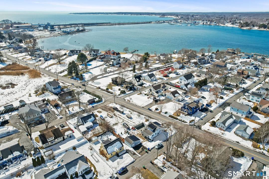 Enjoy shoreline living in this Cape style home just moments from the water with deeded access to Mago Point Beach.