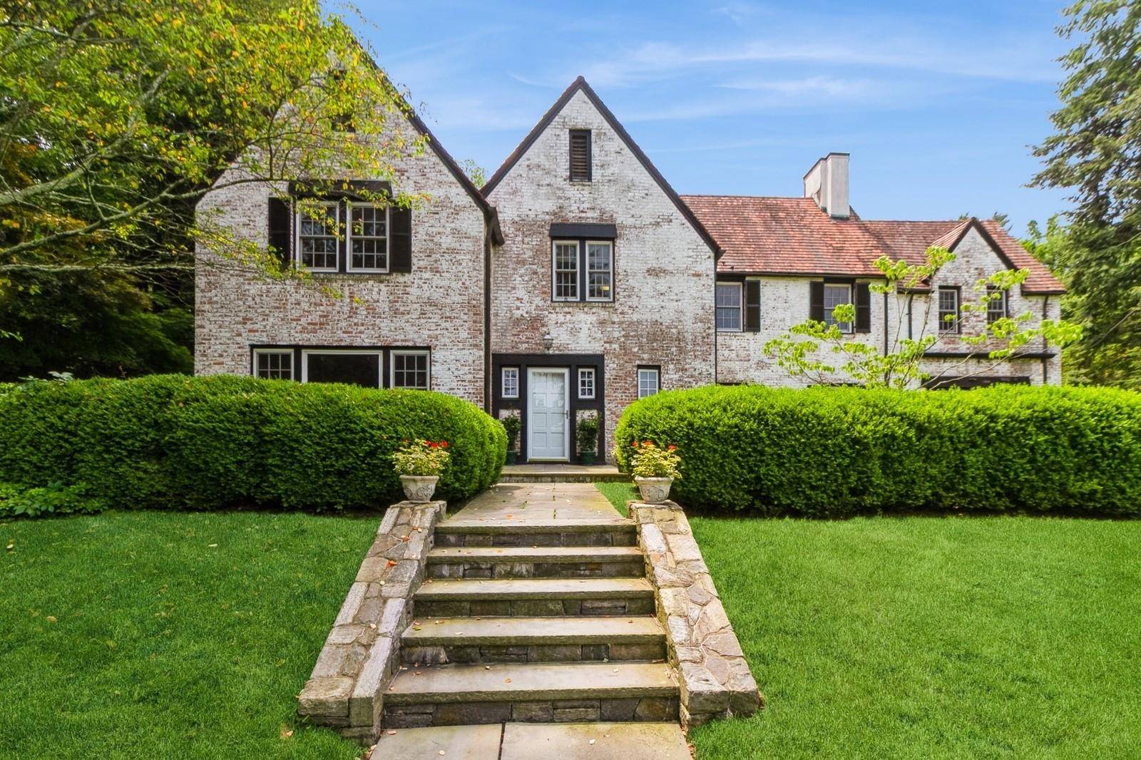 50 Overlook Drive, an elegant 6 bedroom colonial Tudor set in a quiet, tree lined neighborhood.