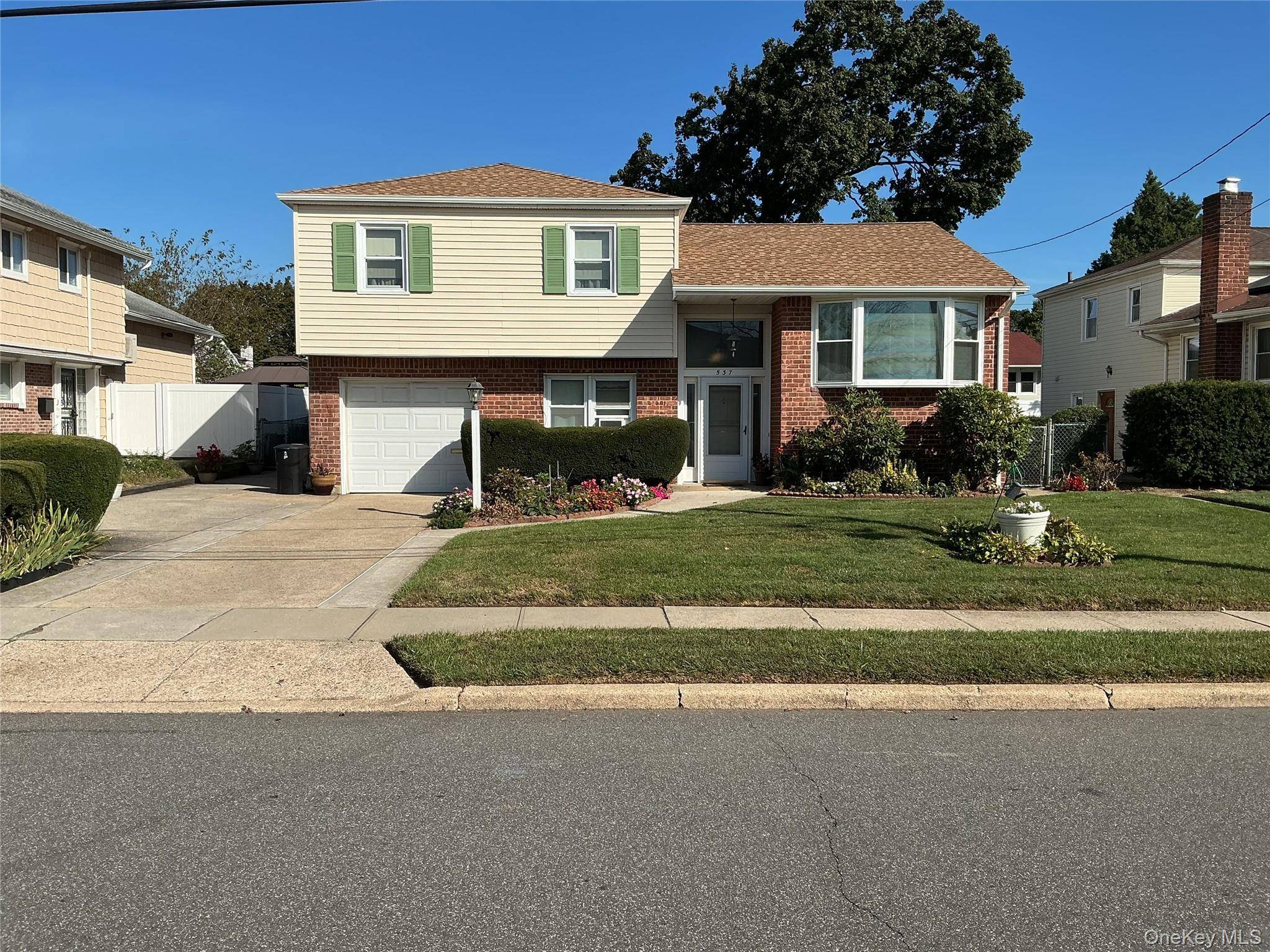 Beautifully Updated Split in the Heart of Westbury Village !