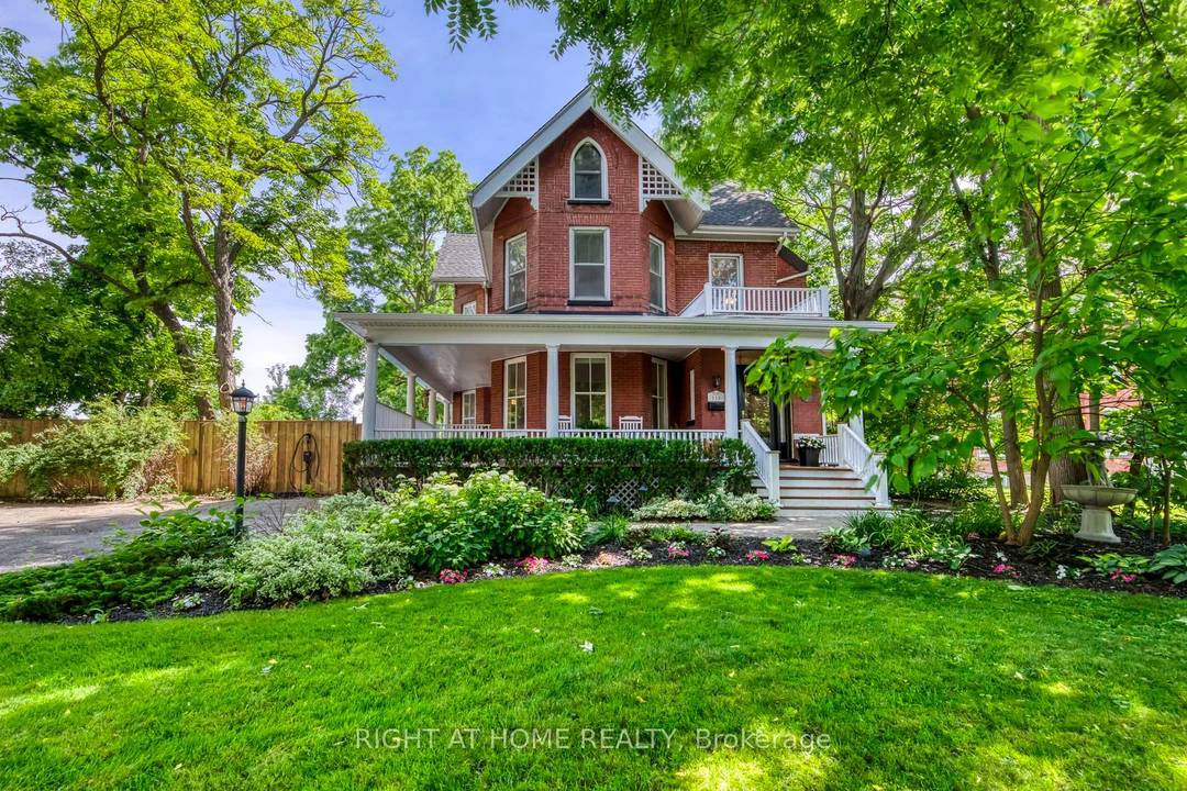 Discreetly set off Main Street on a remarkable treed lot, this exquisitely renovated century home offers a rare blend of heritage charm and refined luxury.