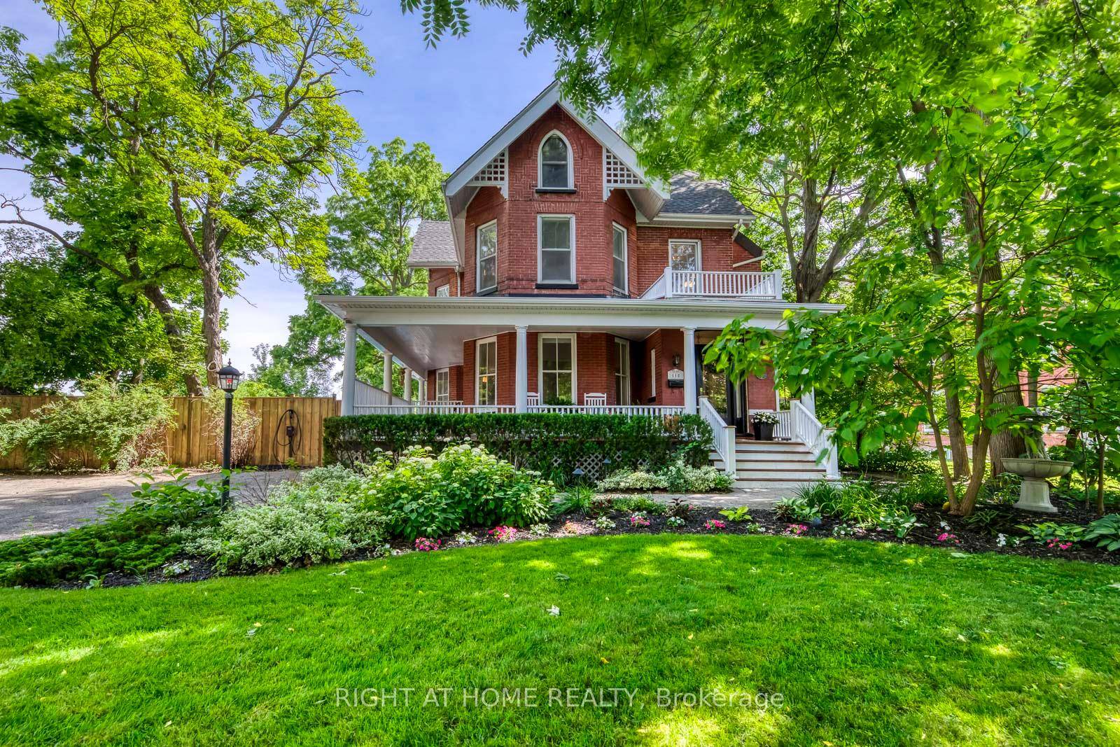 Discreetly set off Main Street on a remarkable treed lot, this exquisitely renovated century home offers a rare blend of heritage charm and refined luxury.