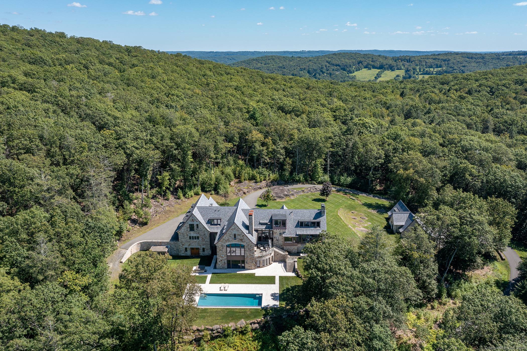 Unparalleled custom built modern estate on 30 acres with jaw dropping views overlooking Lake Waramaug with 100' of lake frontage dock.