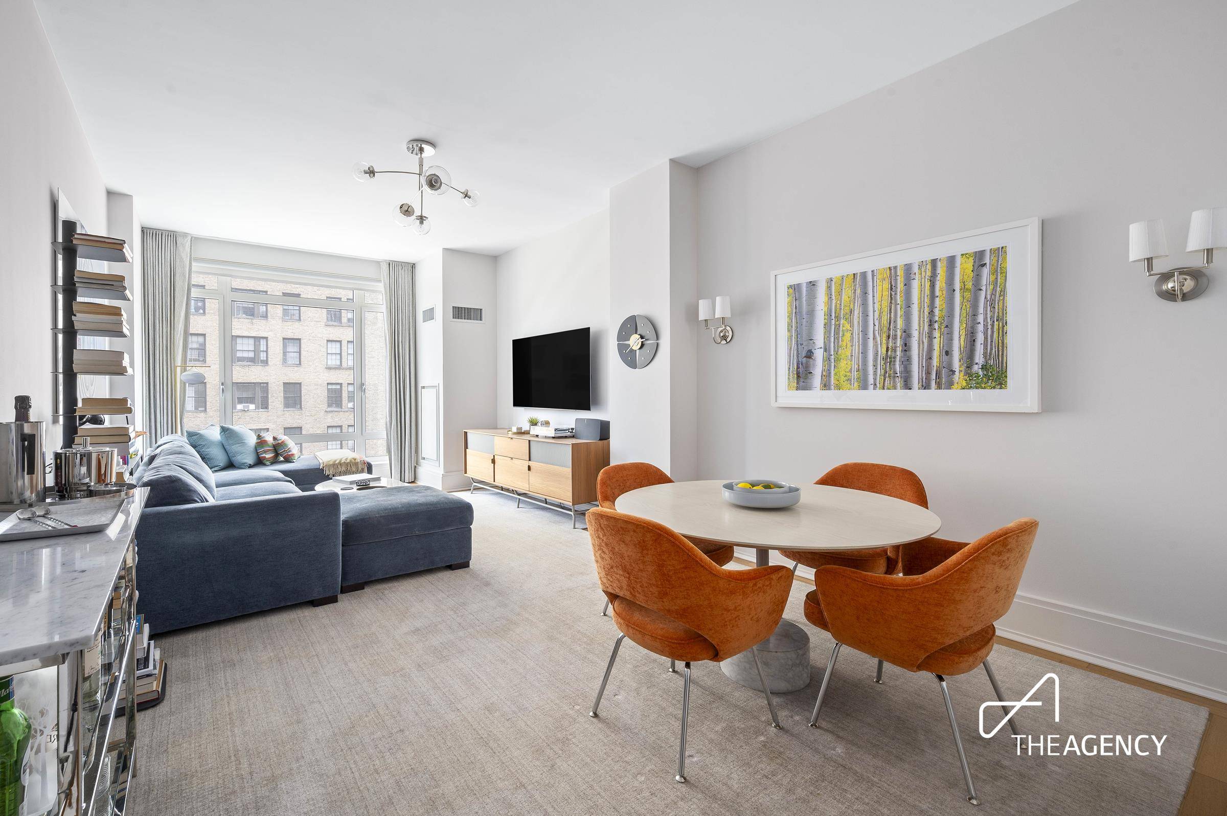 Welcome to this sun drenched, impeccably designed three bedroom, two and a half bath home at The Harrison.