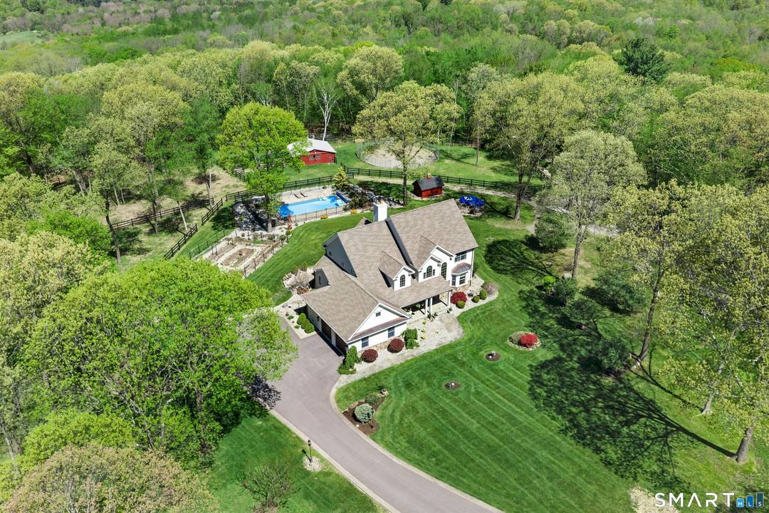 This impeccable 4 bedroom home is sited on 7.