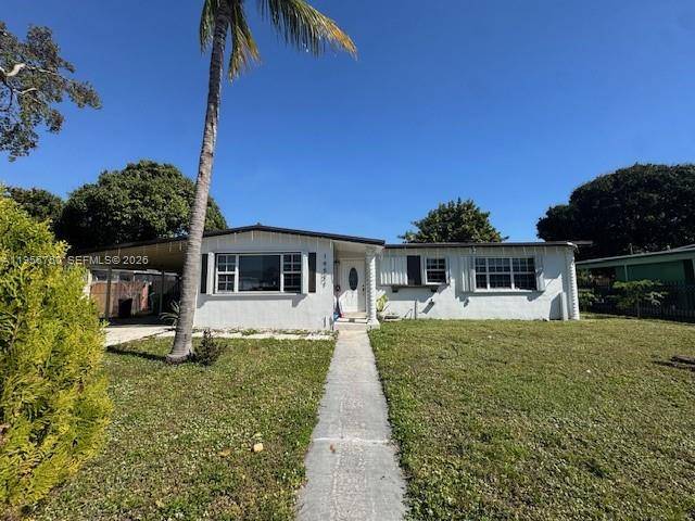Beautiful 3 bedroom, 2 bath single family home featuring a covered carport and a fully fenced driveway.