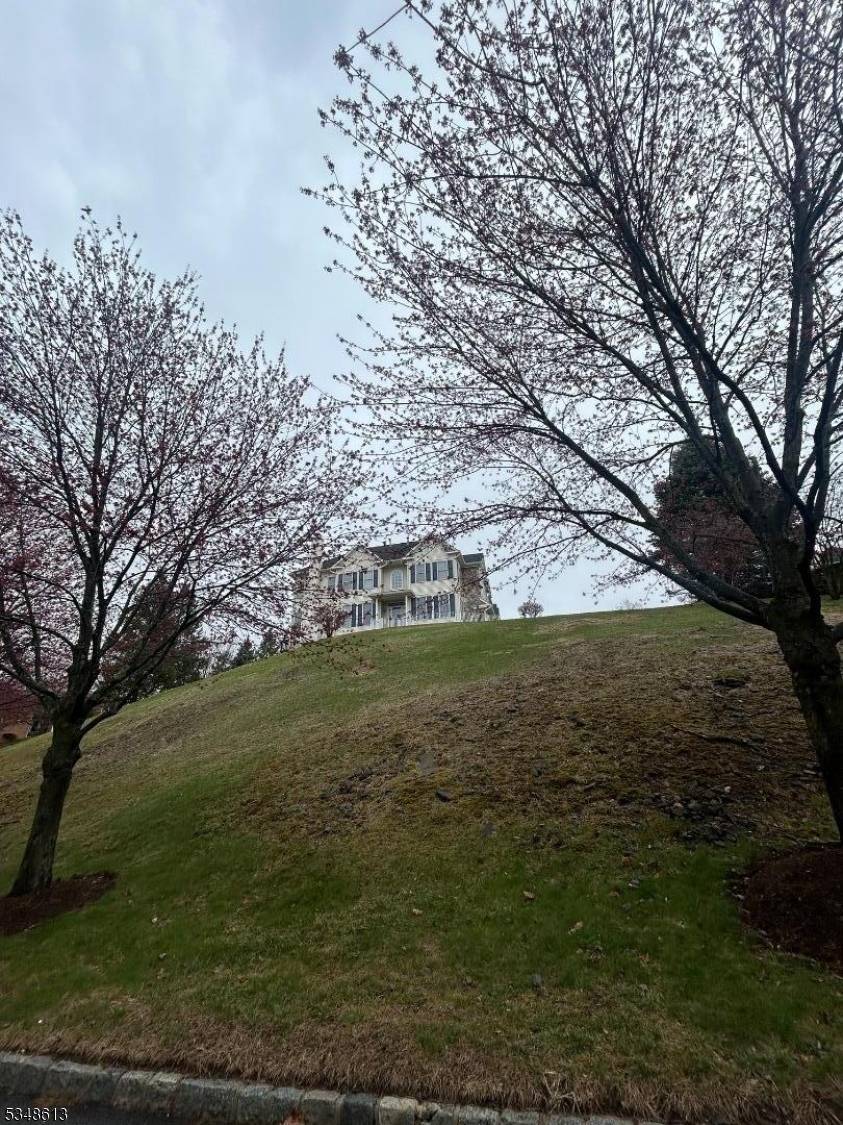 Perched high above the private ROLLING VIEWS community, this exceptional townhome offers refined living with breathtaking panoramic views from every room.