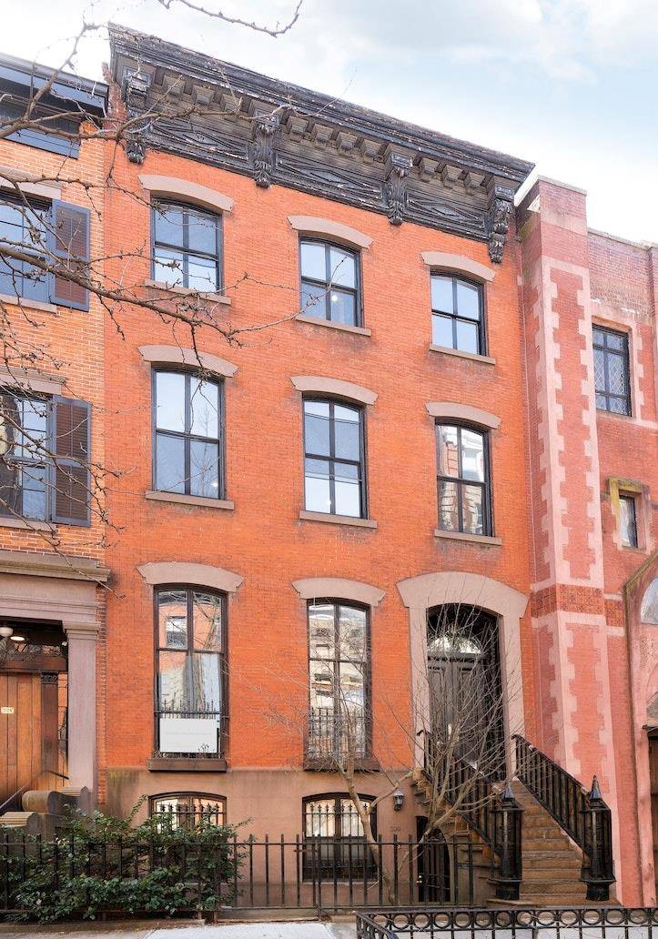 Bring your designer to this tall and handsome 25' wide Italianate townhome located on the most prime street in historic Greenwich Village.