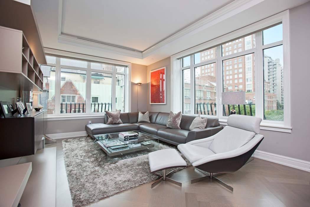 6B is a beautiful home where oversized windows fill the space with natural light and offer charming open views of a classic city block, historic townhouses, and the landmarked Church ...