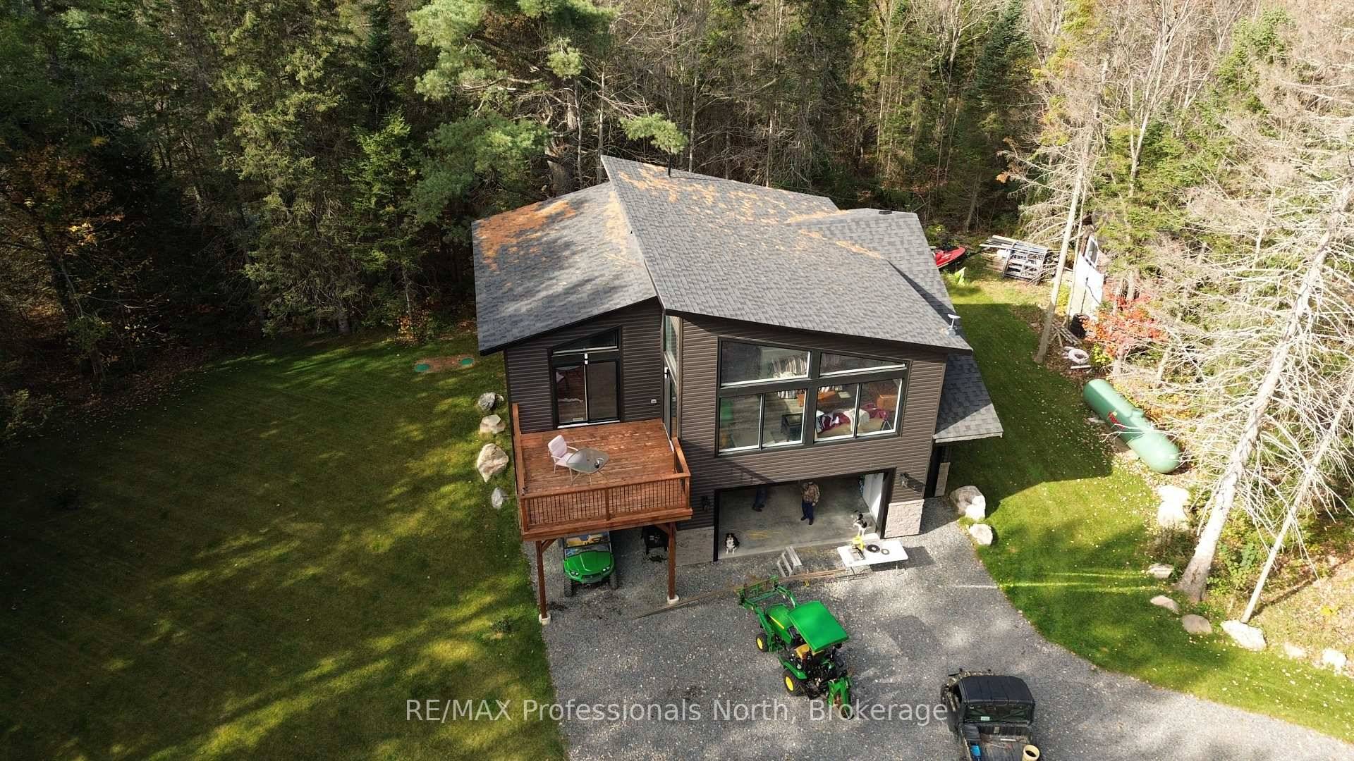 Built in 2023, this beautifully crafted home blends contemporary design with the peaceful charm of a forest setting.