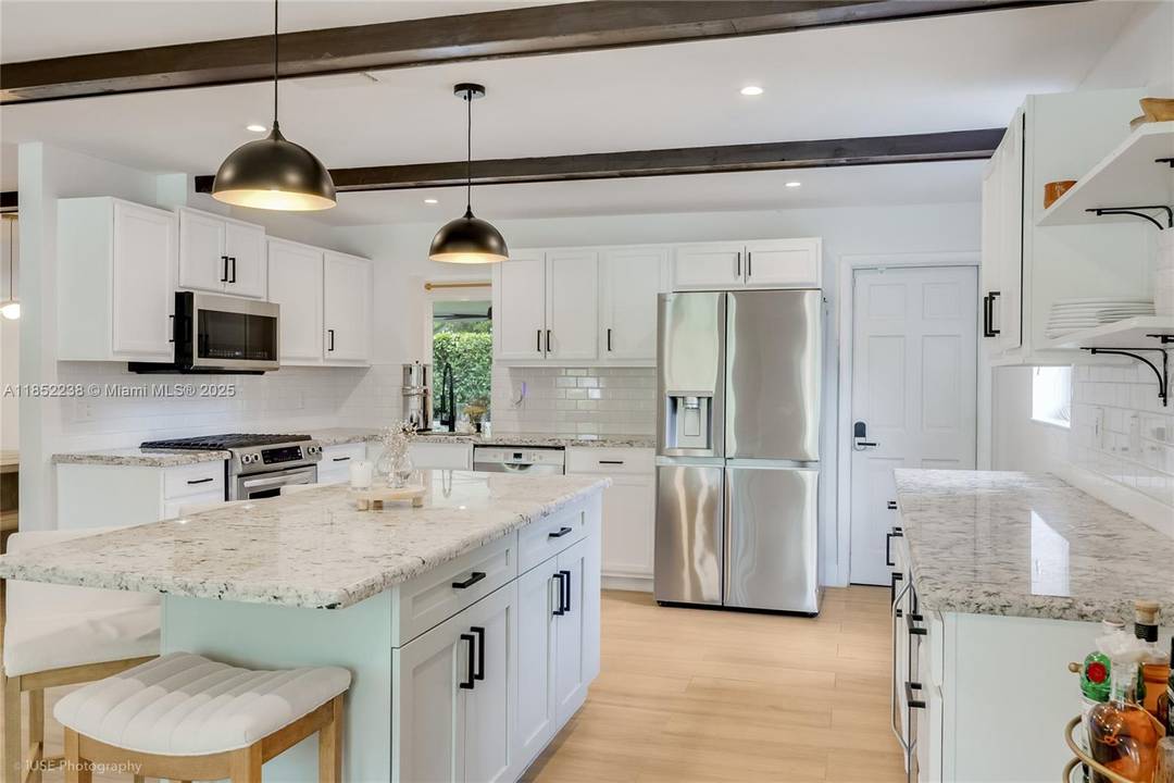 Beautifully updated turn key home in desirable Hollywood Lakes.