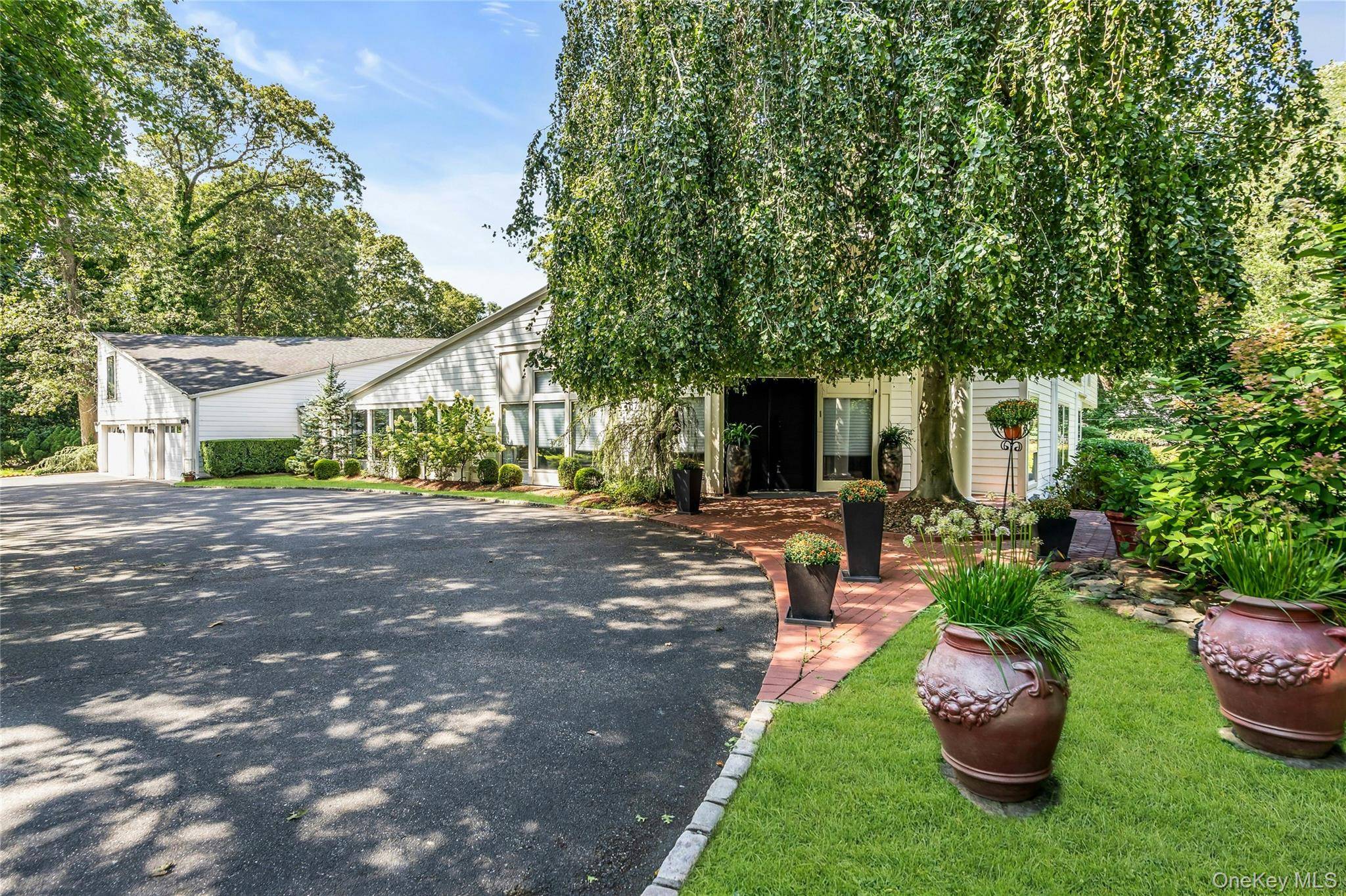 Elegance redefined in this stunning gem on two lush gated acres.
