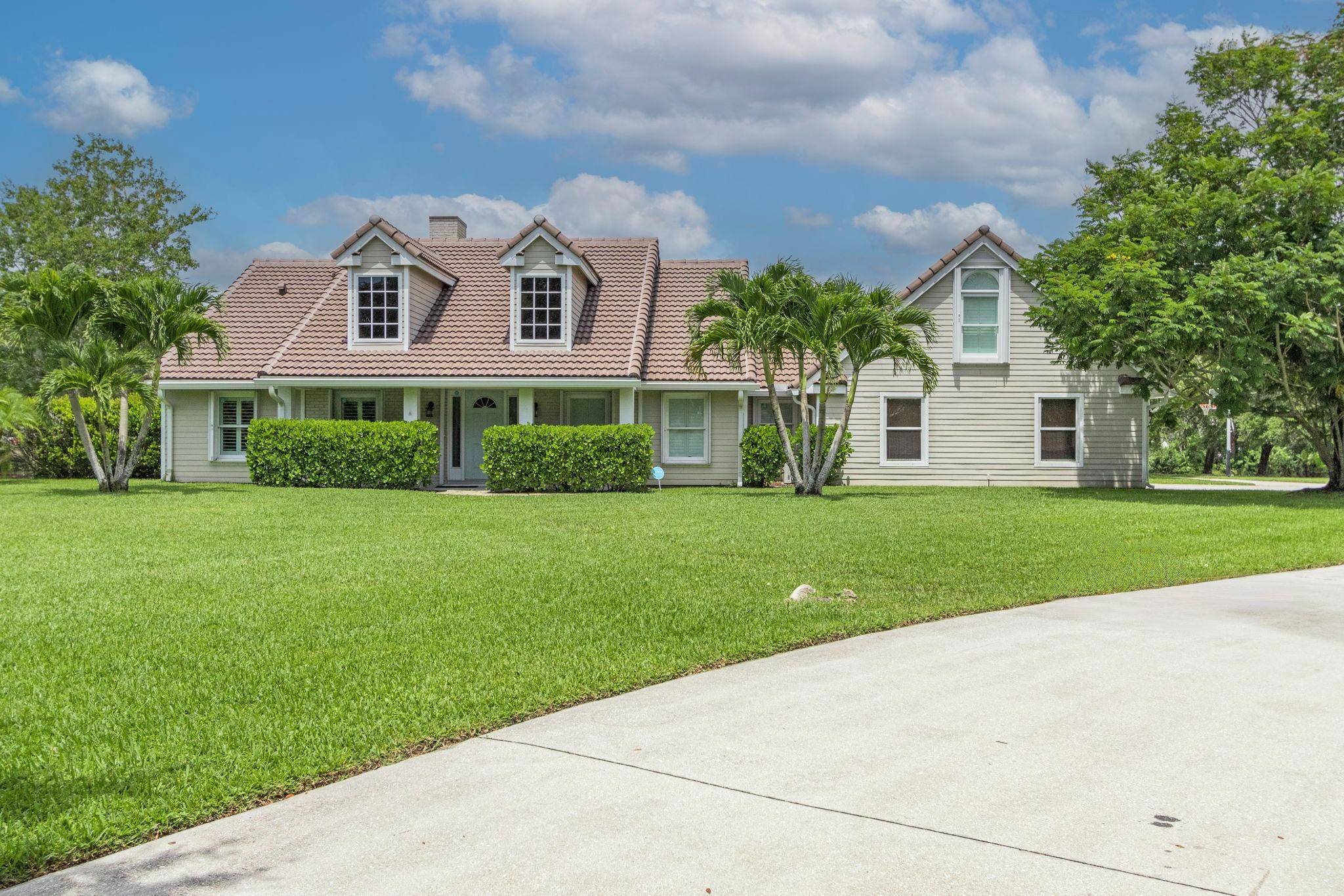 Beautiful custom home on over an acre in gated Lago Del Sol.