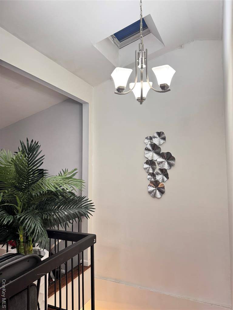 College Point 2 Family Townhouse Condominium With 2 Separate Units Sold As A Combined Package.