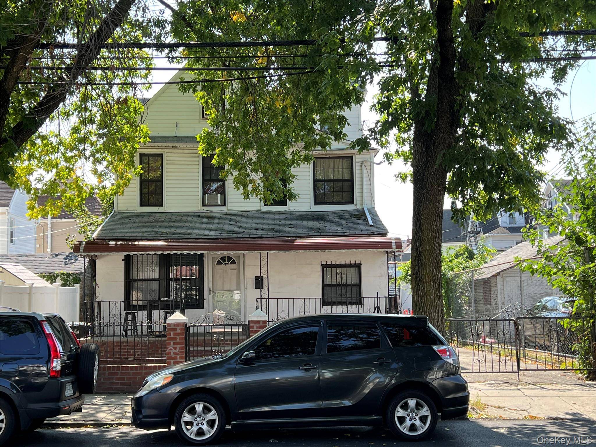 Large 2 family House is fully detached with private driveway and garage.