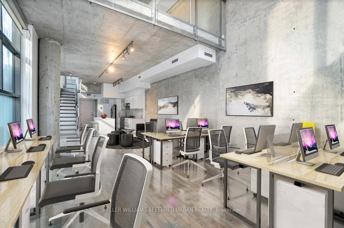 Unveiling the jewel of urban living an unparalleled 2 story corner loft townhouse with an all glass design and soaring 24' high ceiling.