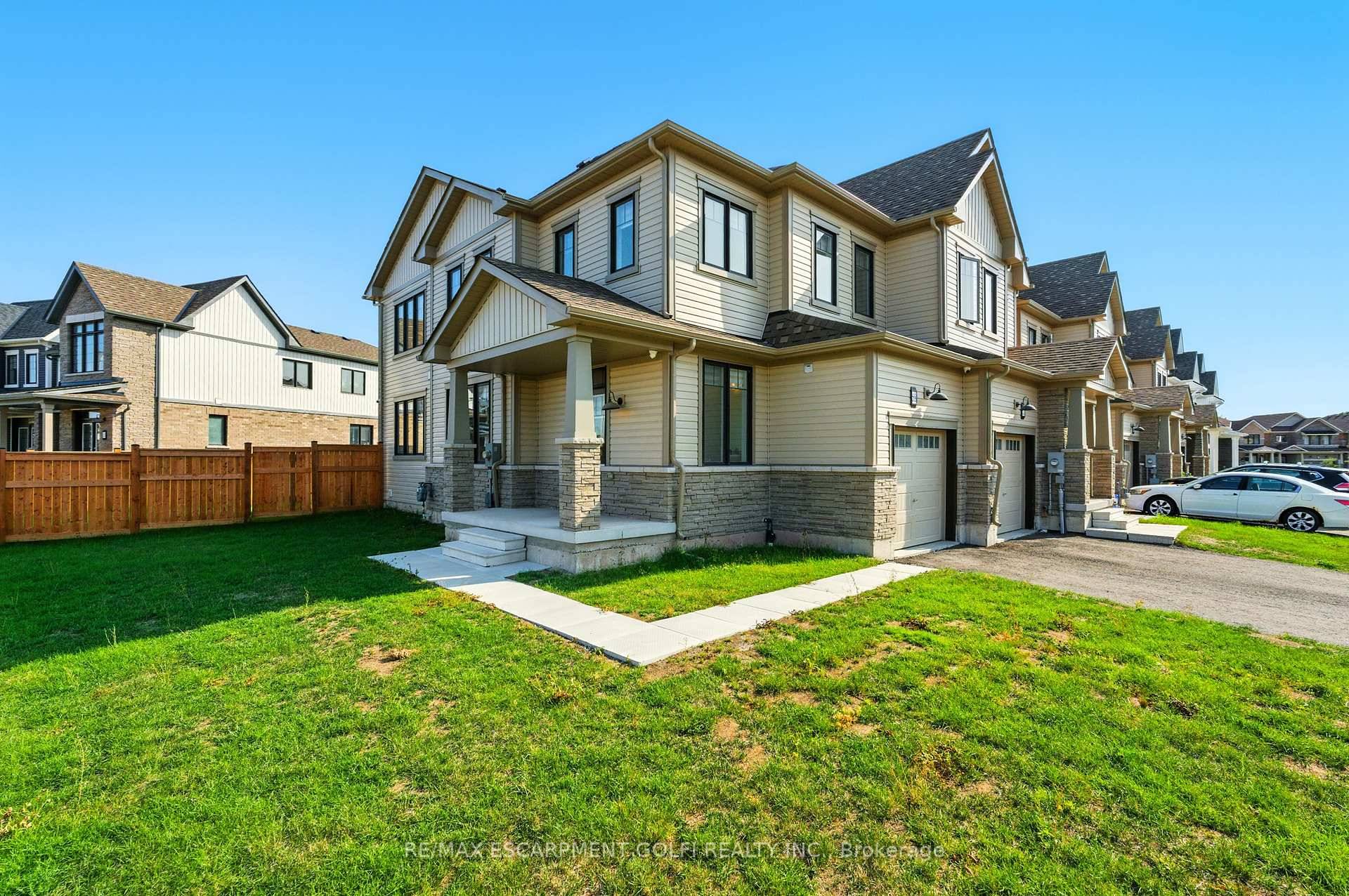 Welcome to 58 Keelson Street in Welland, a bright and modern 2023 end unit townhome that feels more like a detached.