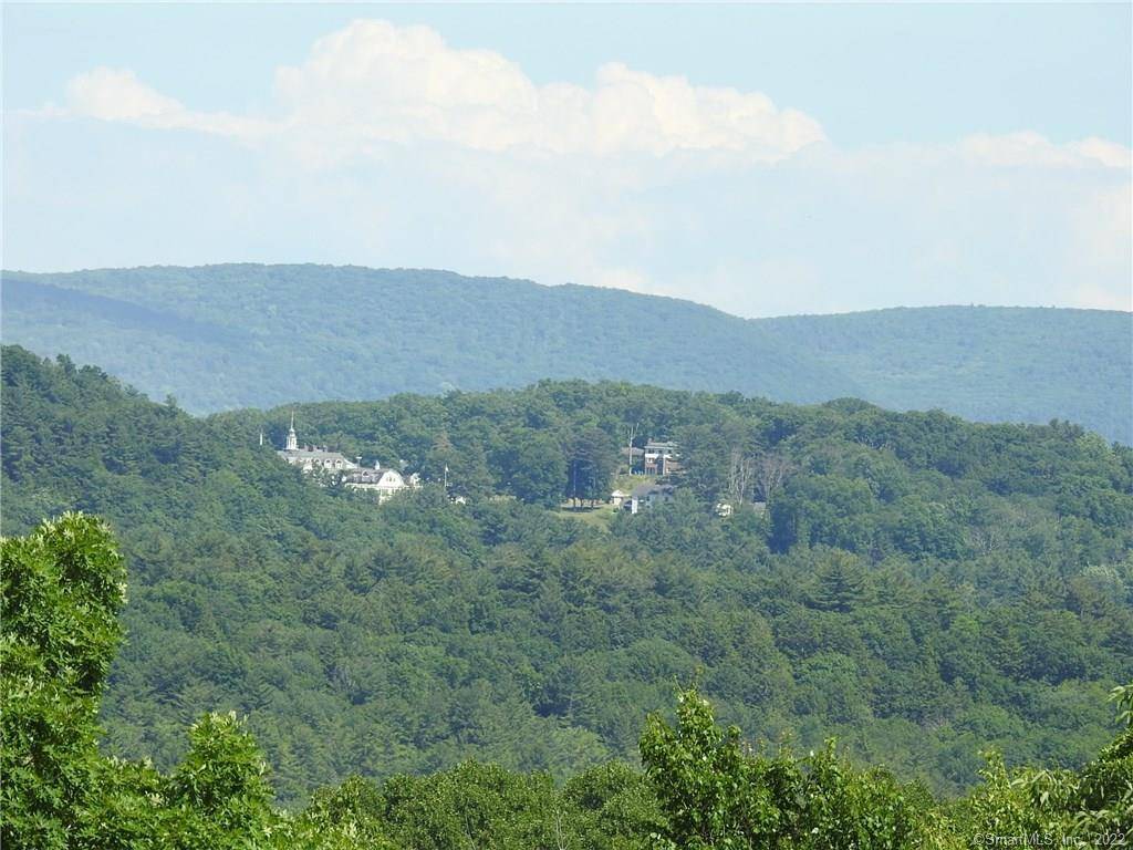 10 acres of land recently cleared, with remainder in woods, now offering SPECTACULAR views for miles.